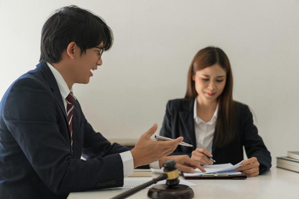 Law and justice concept, Male lawyer explains contract about regulation to consultant in law firm