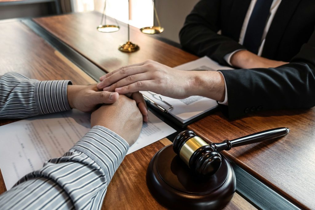 Professional male lawyer or counselor discussing negotiation legal case with client meeting with