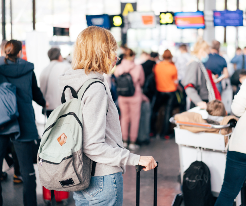 person with a backpack at the airport