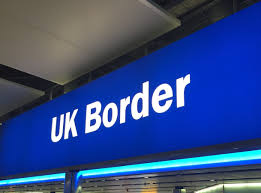 UK Border sign at airport terminal illustrating UK Electronic Travel Authorisation (ETA) entry requirements for travelers entering the United Kingdom.