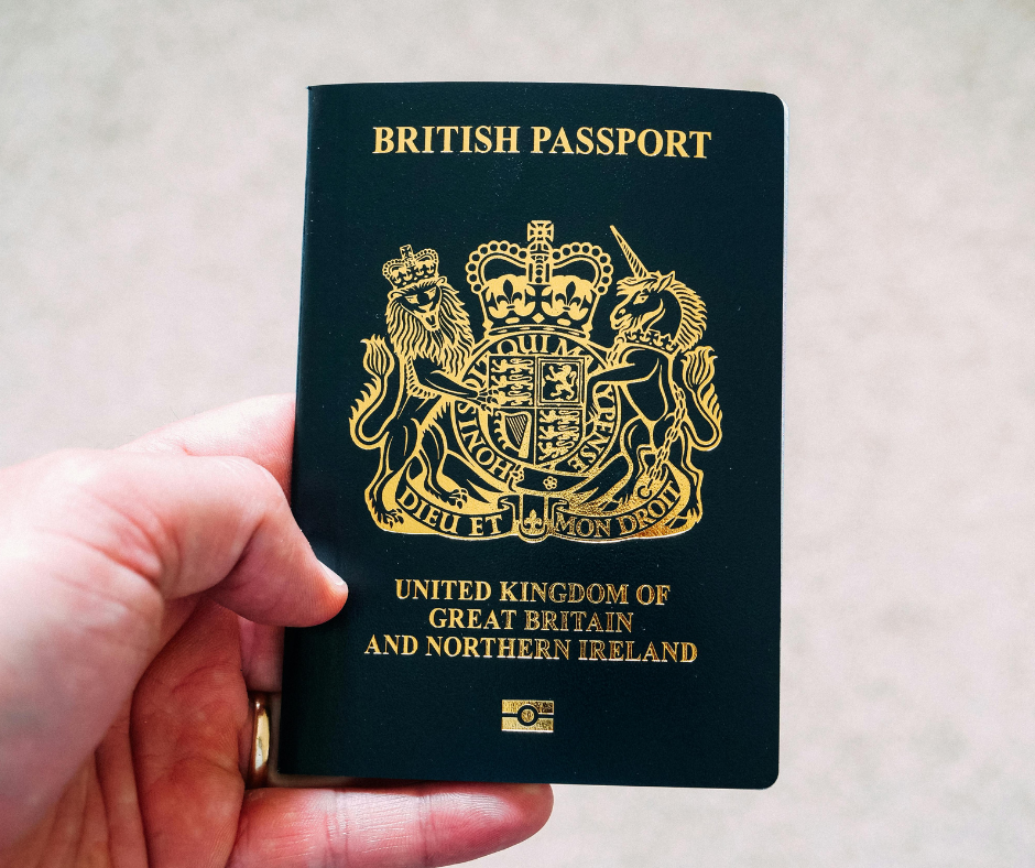 Close-up of a British passport held in a person's hand, illustrating a Statement of Changes to the UK Immigration Rules.